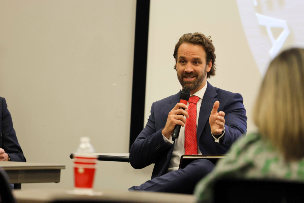 Garrett Wright of Rankin First speaking on a summit panel